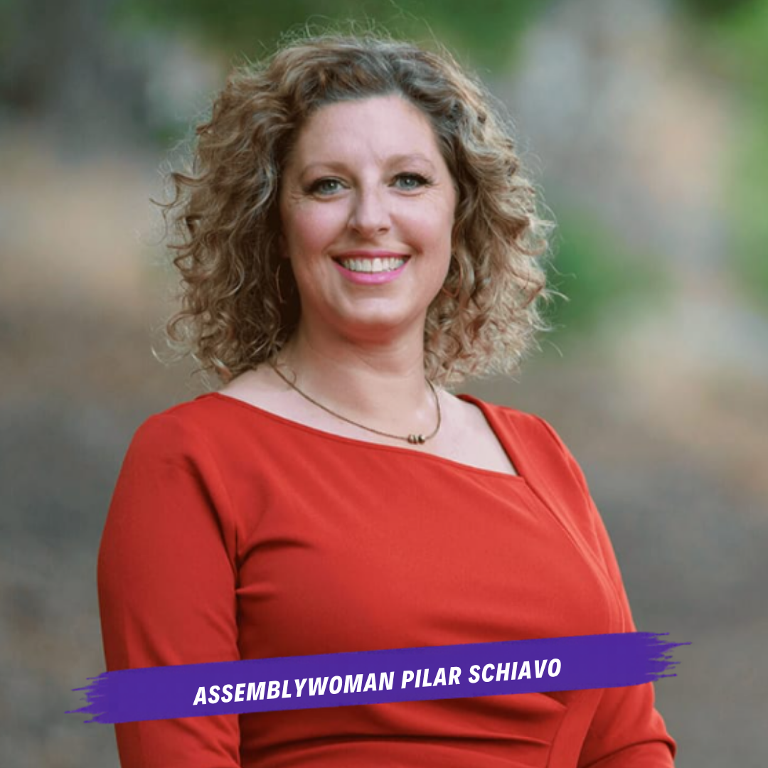 headshot of assemblywoman pilar schiavo, white woman with curly hair and orange dress