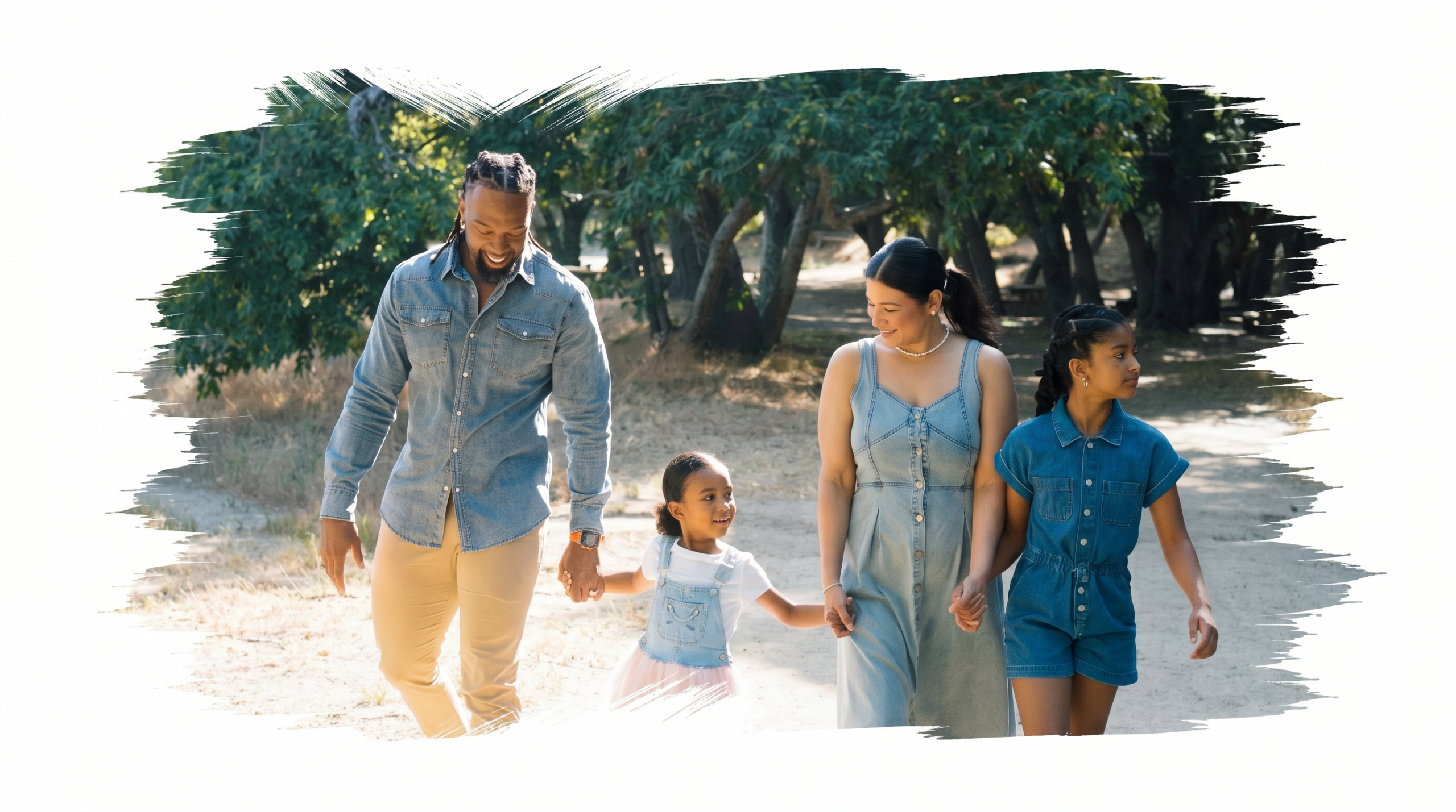 Kelvin Driscoll, a black man, walks with his wife and two daughters on a path through Placerita Canyon Nature Center